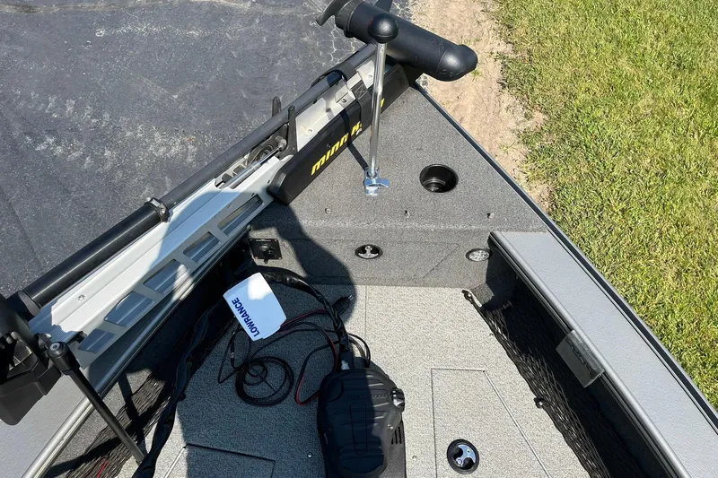 Slide: The Image of 2013 Lund 1875 Pro-V IFS boat interior with Minn Kota trolling motor and Lowrance equipment. - 14