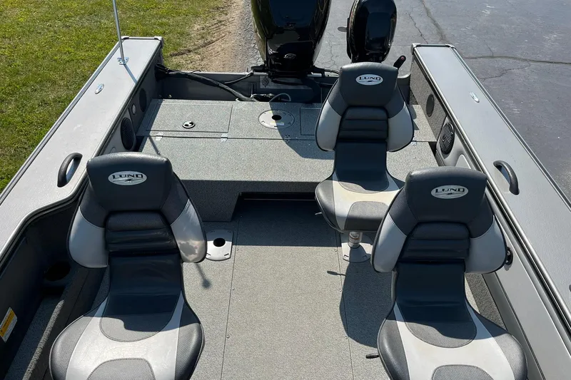 Slide: The Image of 2013 Lund 1875 Pro-V IFS boat interior with two seats and motor. - 15