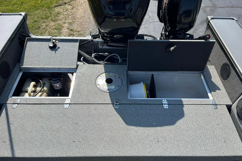 Slide: The Image of 2013 Lund 1875 Pro-V IFS boat storage compartments and engine area. - 17