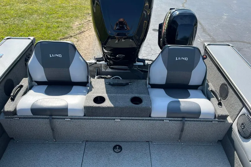 Slide: The Image of 2013 Lund 1875 Pro-V IFS boat interior with dual seats and motor. - 18