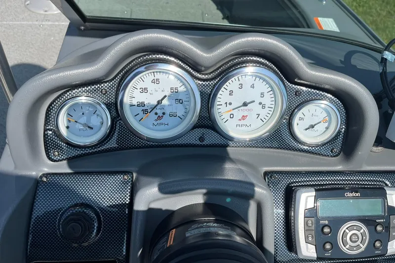 Slide: The Image of Dashboard of 2013 Lund 1875 Pro-V IFS boat with gauges and Clarion audio system. - 20