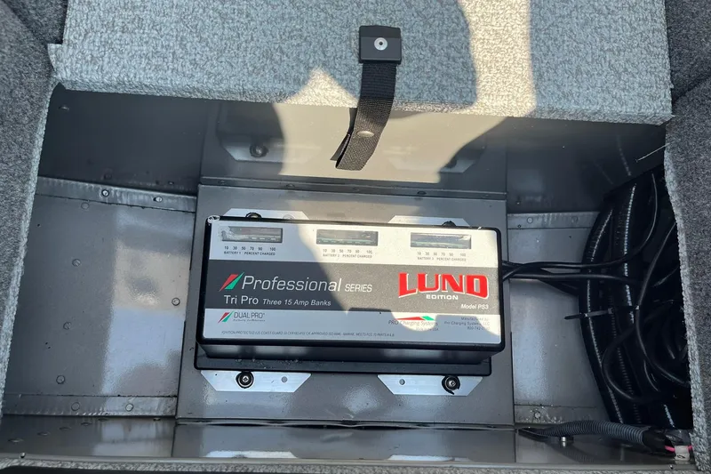 Slide: The Image of 2013 Lund 1875 Pro-V IFS boat battery compartment with Professional Series charger. - 22