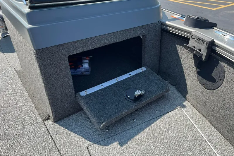 Slide: The Image of 2013 Lund 1875 Pro-V IFS boat storage compartment with open hatch. - 23