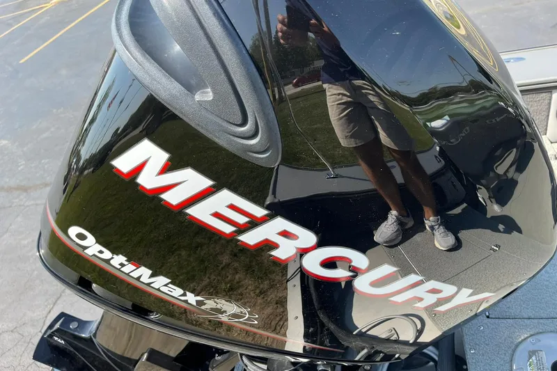 Slide: The Image of Mercury OptiMax engine on 2013 Lund 1875 Pro-V IFS boat, reflecting surroundings. - 27