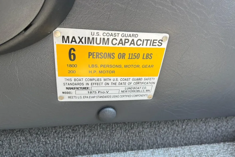 Slide: The Image of 2013 Lund 1875 Pro-V IFS capacity plate, 6 persons or 1150 lbs, 200 HP motor. - 39