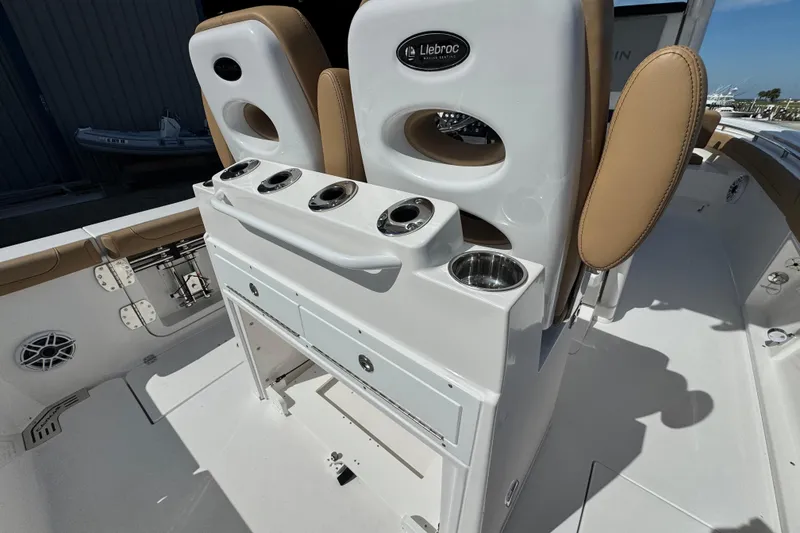 Slide: The Image of 2026 Caymas 291 boat interior with Llebroc seating and cup holders. - 11