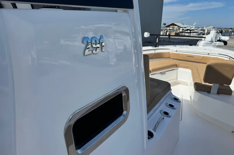Slide: The Image of 2026 Caymas 291 boat interior with seating and storage compartments. - 22