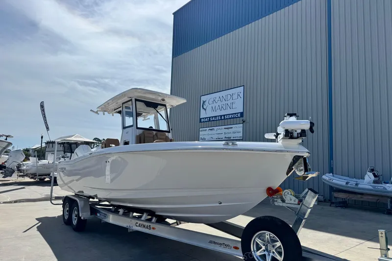 Slide: The Image of 2026 Caymas 291 boat on trailer at Grander Marine dealership. - 8