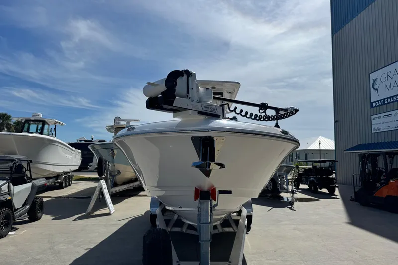 Slide: The Image of 2026 Caymas 291 boat on trailer at marina under clear sky. - 9