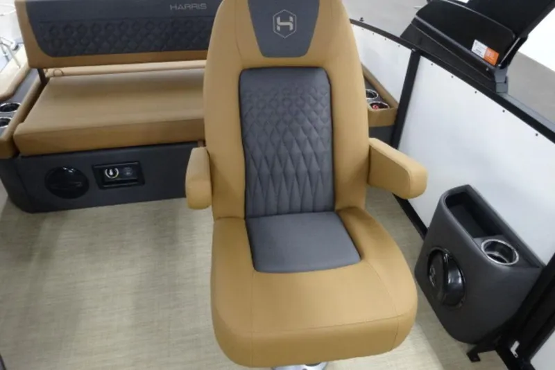 Slide: The Image of Luxurious seating on 2026 Harris Sunliner 250 boat with tan and gray upholstery. - 10