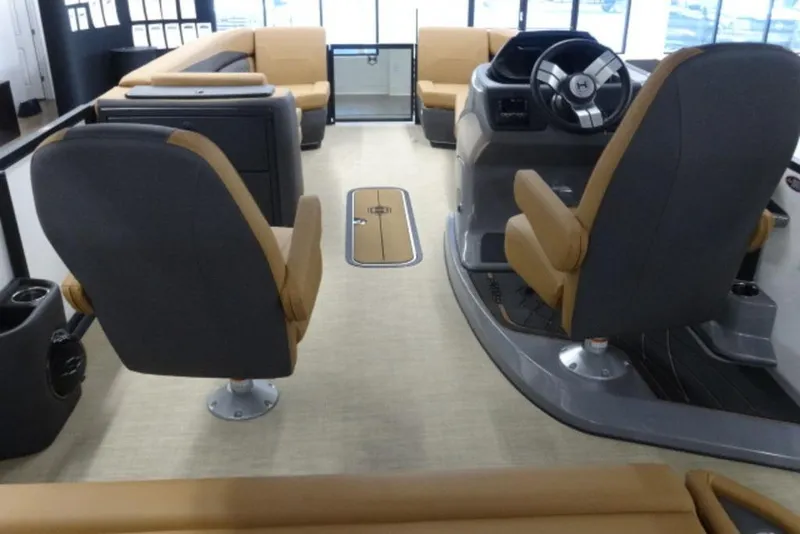 Slide: The Image of Interior of 2026 Harris Sunliner 250 boat with modern seating and steering console. - 17