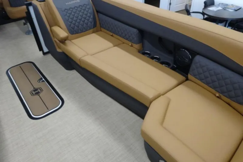 Slide: The Image of 2026 Harris Sunliner 250 interior with tan and gray seating, luxurious design. - 6