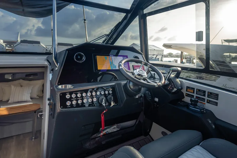 Slide: The Image of 2025 Hanover 387 boat cockpit with modern navigation system and luxurious interior. - 10