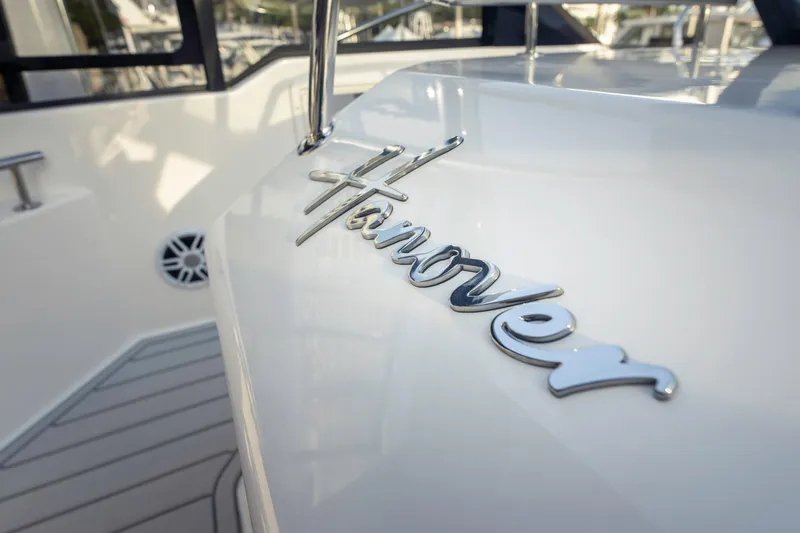Slide: The Image of 2025 Hanover 387 boat cruising on open water, aerial view. - 13