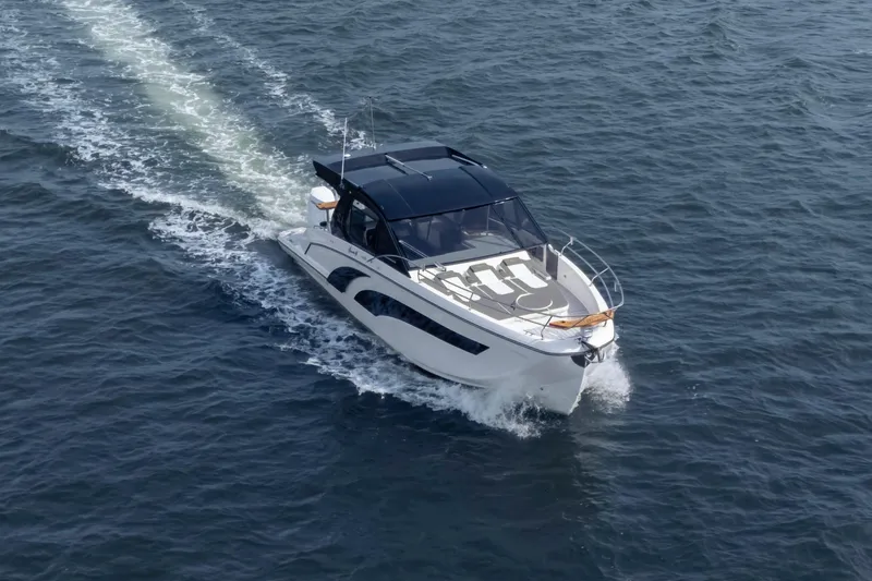 Slide: The Image of Luxury Hanover 387 yacht cruising on open water, 2025 model. - 14