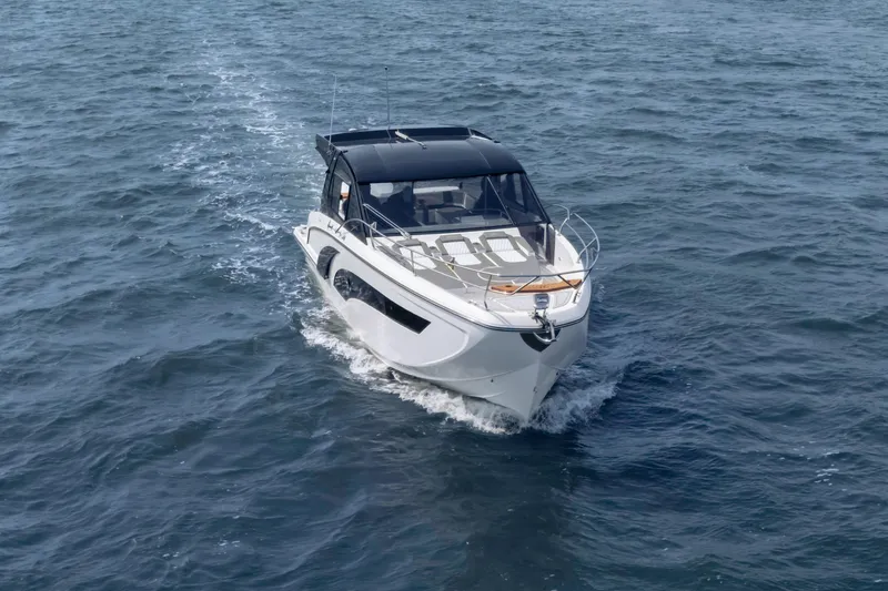 Slide: The Image of 2025 Hanover 387 boat cruising on open water. - 16