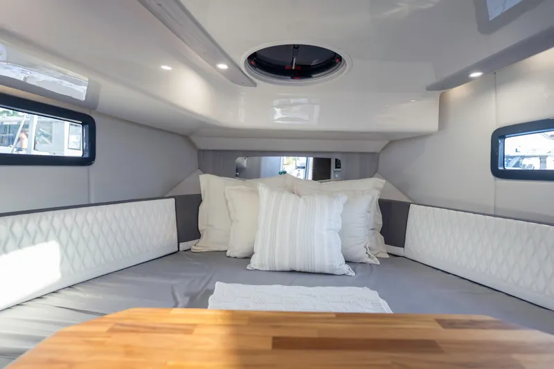 Slide: The Image of Interior of 2025 Hanover 387 boat cabin with cozy bedding and modern design. - 19
