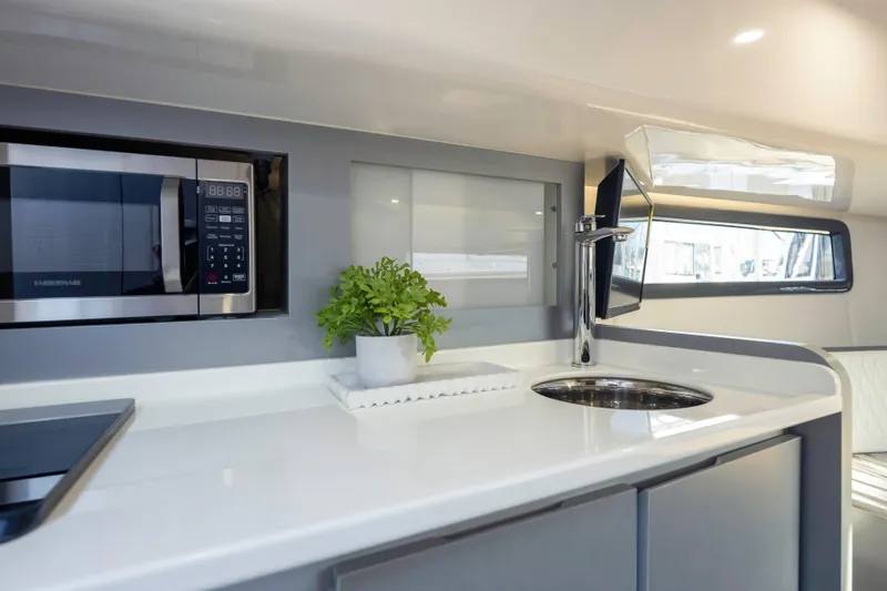 Slide: The Image of Modern kitchen interior of Hanover 387 yacht, featuring sleek design and built-in appliances, 2025 model. - 22