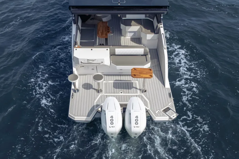 Slide: The Image of Aerial view of 2025 Hanover 387 boat with dual engines on open water. - 3
