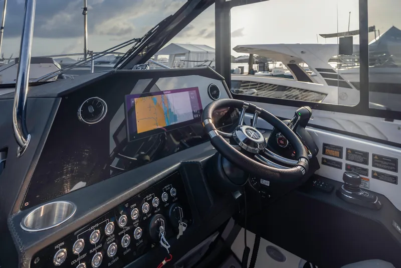 Slide: The Image of Helm of 2025 Hanover 387 yacht with advanced navigation system and controls. - 9
