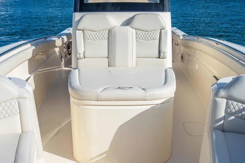 Slide: The Image of Manufacturer Provided Image: 2026 Scout 288 LXF boat interior with luxurious seating and ocean backdrop. - 4