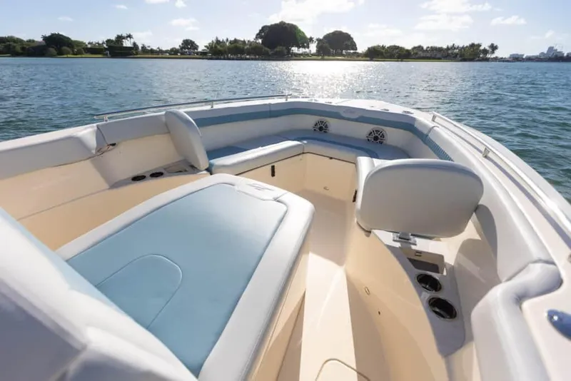 Slide: The Image of Manufacturer Provided Image: 2025 Scout 260 LXF boat interior with blue seating on a sunny day. - 4