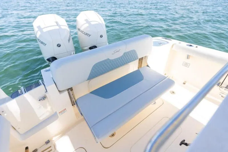 Slide: The Image of Manufacturer Provided Image: 2025 Scout 260 LXF boat with dual Mercury engines on calm water. - 9