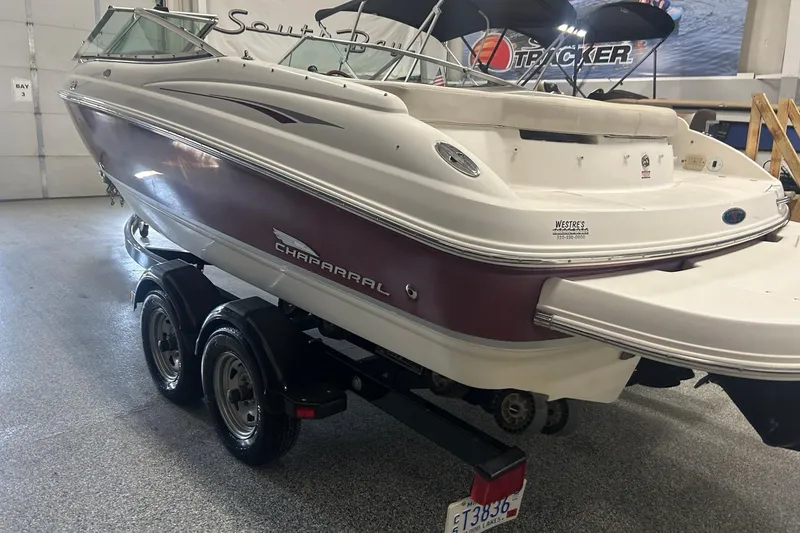 Slide: The Image of 2004 Chaparral 204 SSi boat on trailer in indoor showroom. - 4