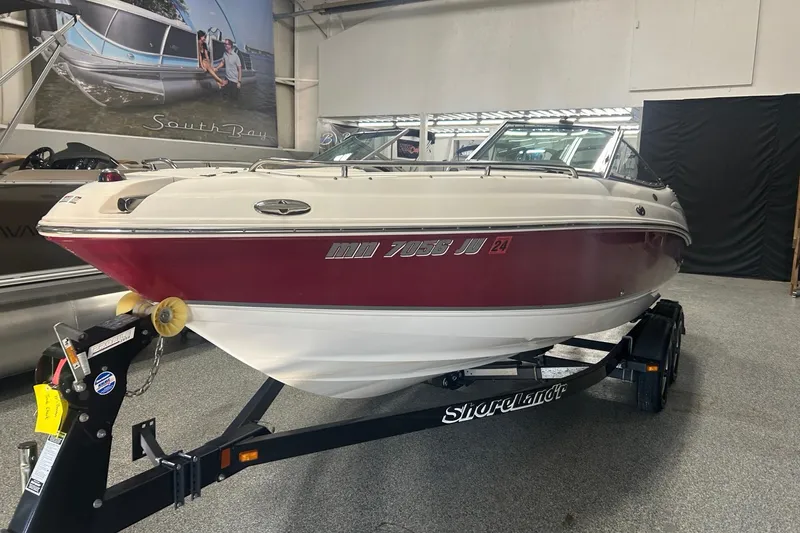 Slide: The Image of 2004 Chaparral 204 SSi boat on trailer in showroom setting. - 5