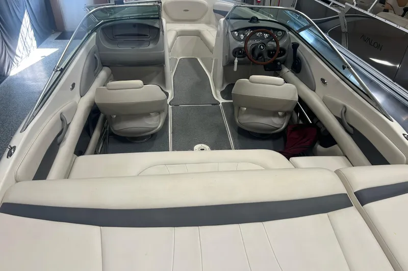 Slide: The Image of Interior of a 2004 Chaparral 204 SSi boat with seating and steering wheel. - 7