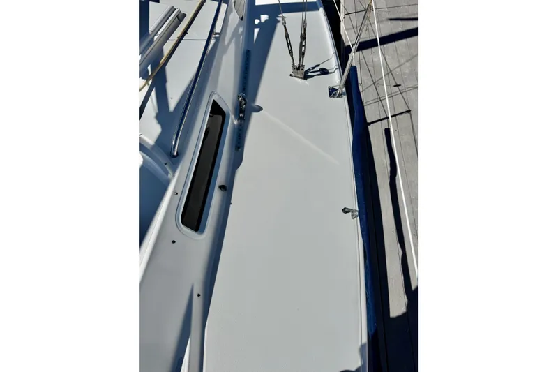 Slide: The Image of 1999 J Boats J/105 deck view with sleek design and stainless steel fittings. - 24