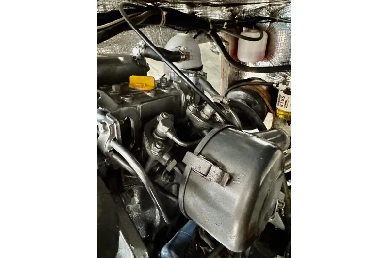 Slide: The Image of Engine compartment of a 1999 J Boats J/105 sailboat, showing mechanical components. - 27