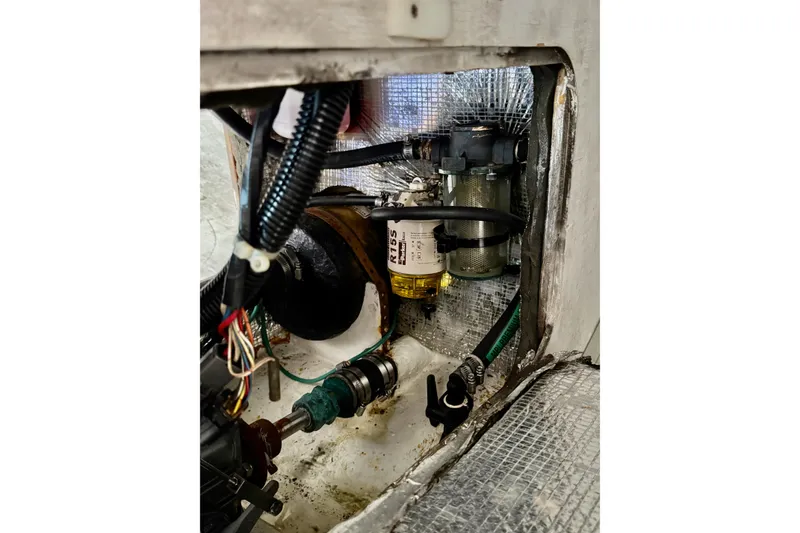 Slide: The Image of Engine compartment of a 1999 J Boats J/105, showing wiring and fuel filter. - 28