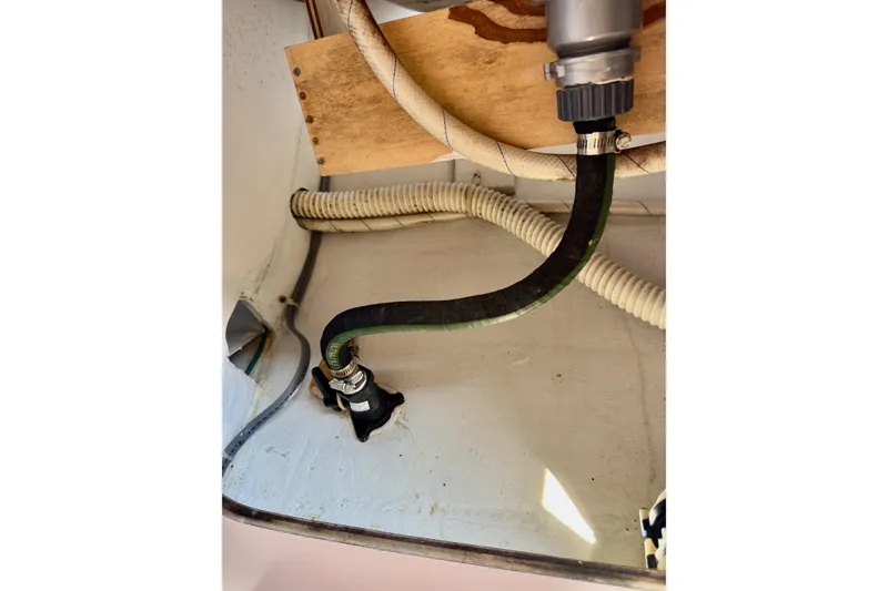 Slide: The Image of 1999 J Boats J/105 interior plumbing with hoses and fittings. - 32