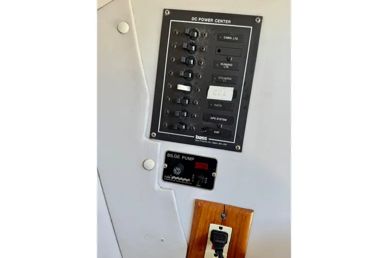Slide: The Image of Control panel of a 1999 J Boats J/105, featuring DC power center and bilge pump. - 34