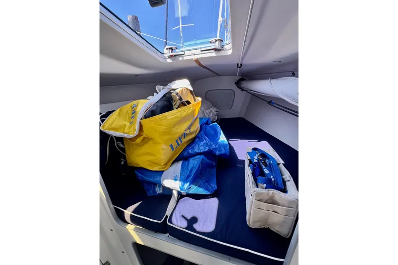 Slide: The Image of Interior of 1999 J Boats J/105 sailboat with gear and equipment stored. - 39