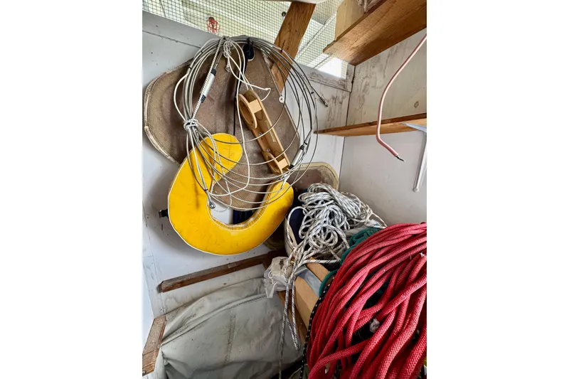 Slide: The Image of Boat storage area with ropes, life ring, and equipment on a 1999 J Boats J/105. - 43