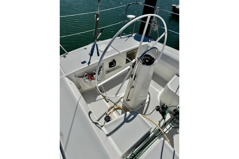 Slide: The Image of Cockpit of 1999 J Boats J/105 sailboat with steering wheel and navigation instruments. - 7