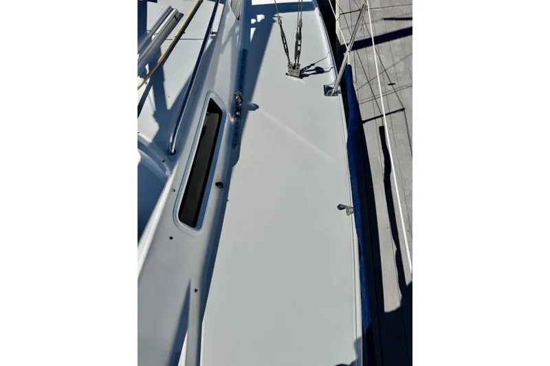 Slide: The Image of 1999 J Boats J/105 deck view with sleek design and stainless steel fittings. - 8
