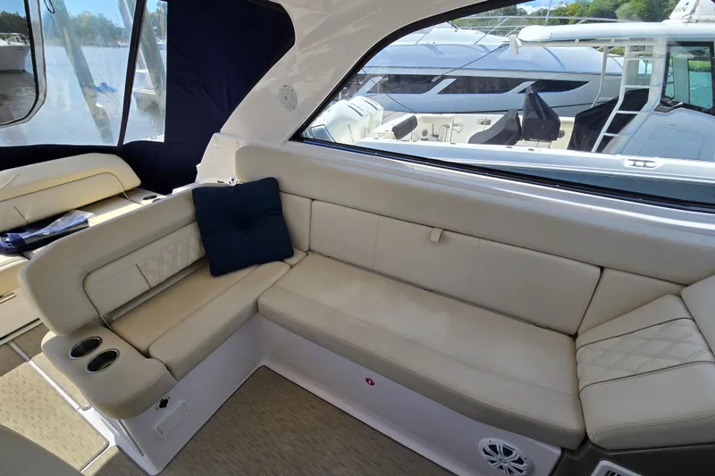 Slide: The Image of Luxurious interior of 2018 Regal 35 Sport Coupe with beige seating and blue cushion. - 10