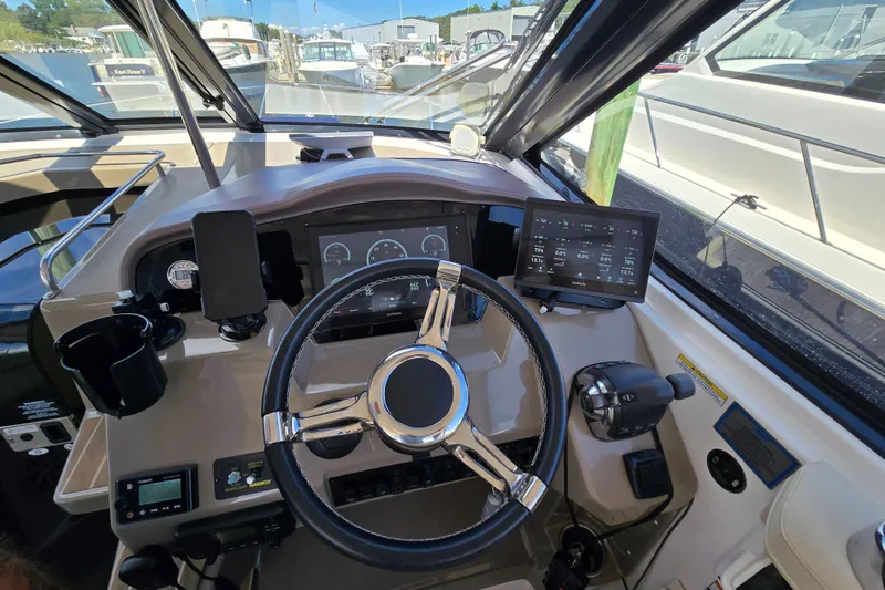 Slide: The Image of 2018 Regal 35 Sport Coupe helm with modern controls and navigation displays. - 13