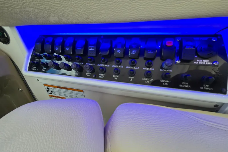 Slide: The Image of Control panel of a 2018 Regal 35 Sport Coupe with illuminated switches and labels. - 14