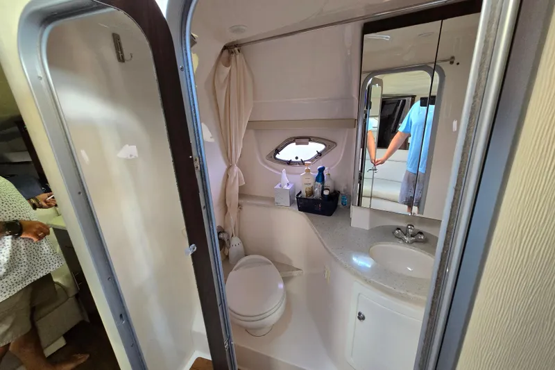 Slide: The Image of Bathroom interior of 2018 Regal 35 Sport Coupe with sink, toilet, and mirror. - 20