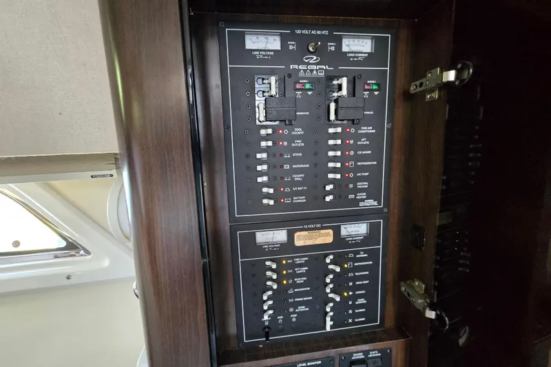 Slide: The Image of Electrical control panel on a 2018 Regal 35 Sport Coupe boat. - 21
