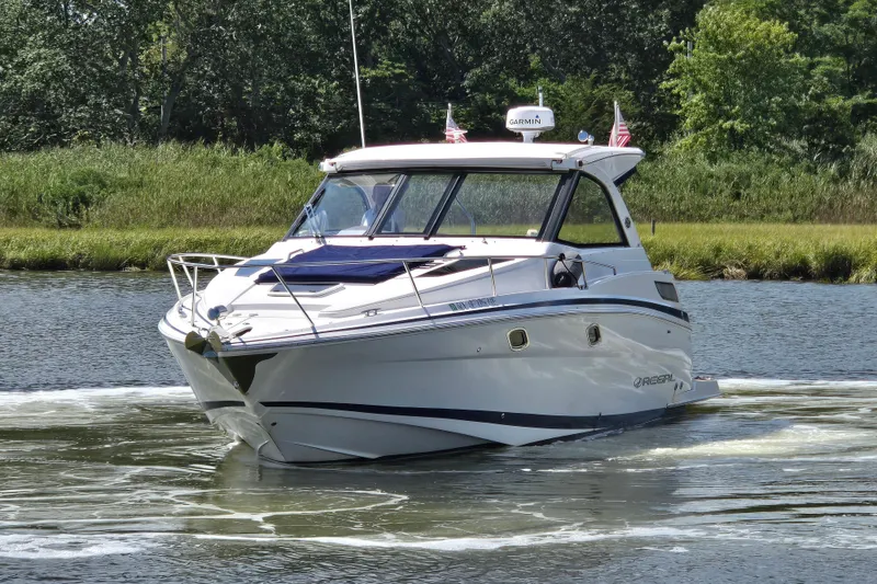 Slide: The Image of 2018 Regal 35 Sport Coupe cruising on a scenic river. - 4