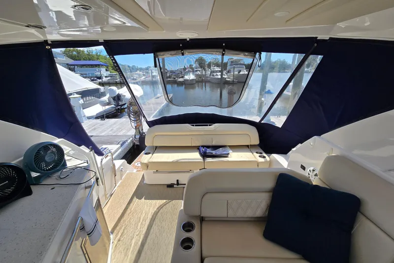 Slide: The Image of Interior of 2018 Regal 35 Sport Coupe yacht with seating and marina view. - 8