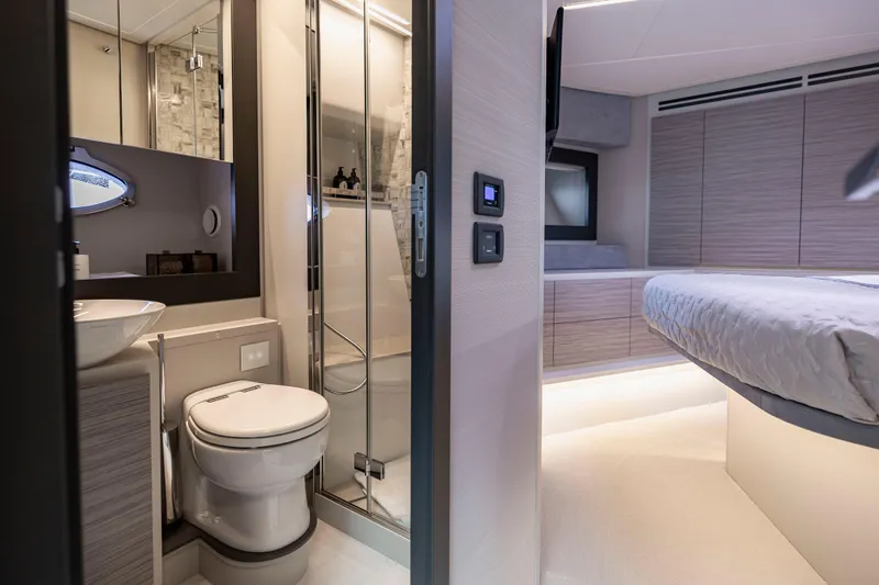 Slide: The Image of Luxurious interior of 2021 Pershing 62 yacht featuring modern bathroom and bedroom design. - 100