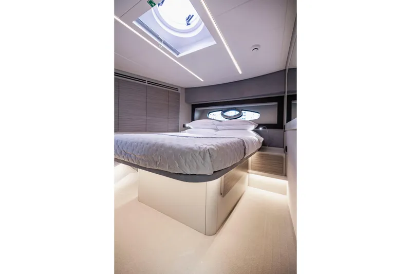 Slide: The Image of Luxurious bedroom interior of 2021 Pershing 62 yacht with modern design and skylight. - 102