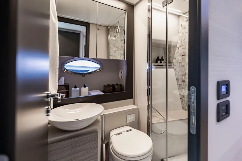 Slide: The Image of Luxurious bathroom interior of 2021 Pershing 62 yacht with modern fixtures and elegant design. - 105