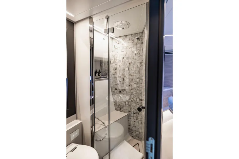 Slide: The Image of Luxurious bathroom in 2021 Pershing 62 yacht with modern shower and elegant design. - 106
